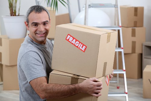 Removal team preparing household items for a booked move