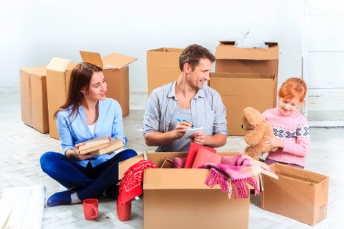 Removal team planning house removals in Brent with boxes and moving van
