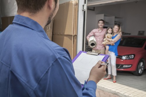Stacked moving boxes and packed household items for a Brent house move