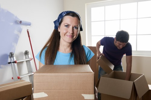 Professional movers transporting household items in Brent