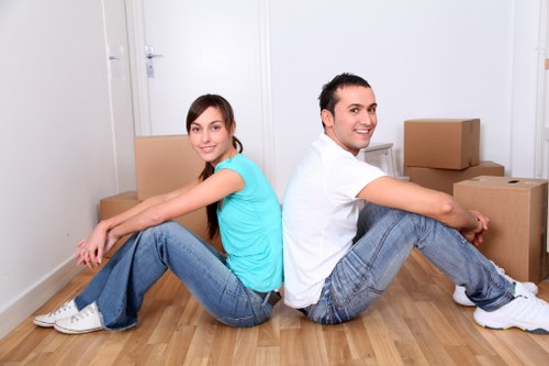 Specialist team planning a piano move in Brent with transport equipment