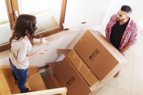 Boxes and wrapped furniture inside a removal vehicle for a Brent home relocation