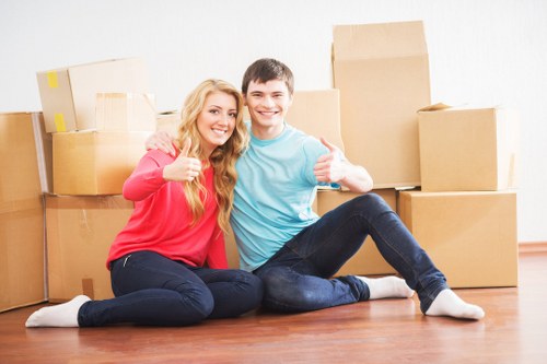 Loading furniture and boxes into a moving truck in Brent