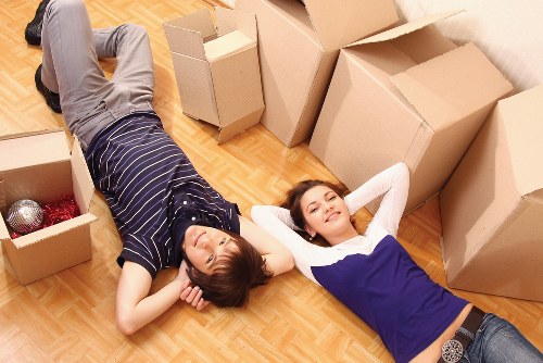 Team organizing desks and IT setup after office removals in Brent