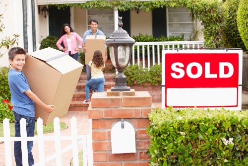 Professional movers loading household items for same day removals in Brent